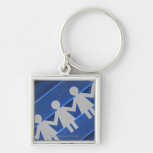 Close-up of paper chain dolls key ring
