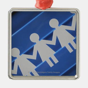 Close-up of paper chain dolls metal tree decoration