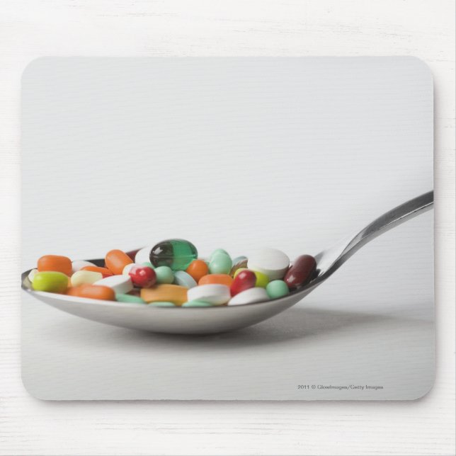 Close-up of pills in a spoon mouse pad (Front)