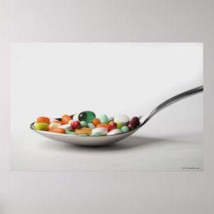 Close-up of pills in a spoon poster