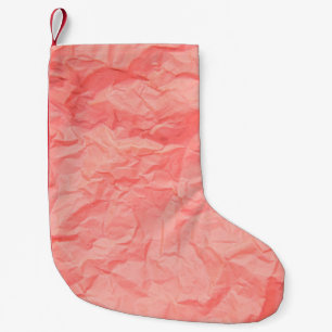 Close up of pink wrinkle crumpled old with paper p small christmas stocking