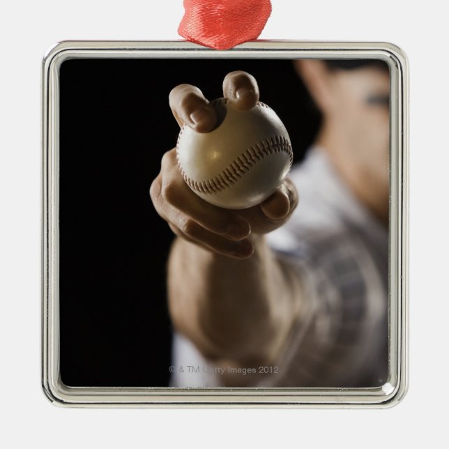 Close up of pitcher holding baseball metal tree decoration (Front)