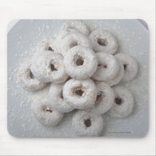 Close-up of powdered doughnuts in a plate mouse pad