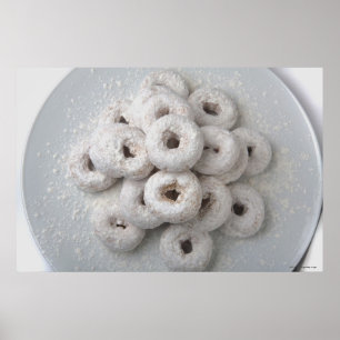 Close-up of powdered doughnuts in a plate poster