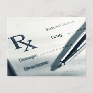 Close up of prescription pad and pen postcard