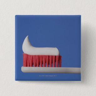 Close-up of toothpaste on a toothbrush 15 cm square badge