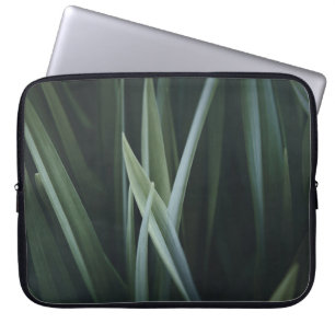 Close up photo of green linear leaves laptop sleeve