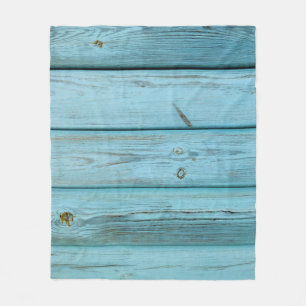 Close-up photo of green planks fleece blanket