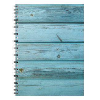 CLOSE-UP PHOTO OF GREEN PLANKS NOTEBOOK