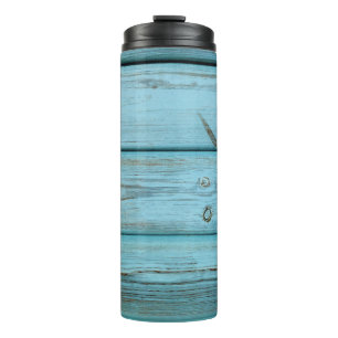 Close-up photo of green planks thermal tumbler