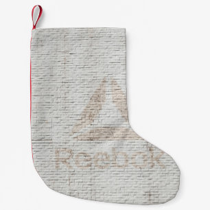 Close-up photo of Reebok logo on wall Small Christmas Stocking