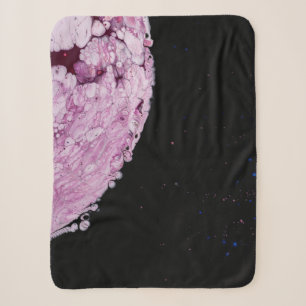 Close view of pink planet cartoon image sherpa blanket