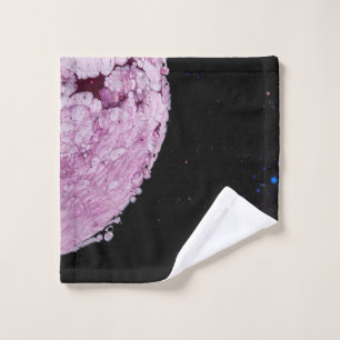 Close view of pink planet cartoon image wash cloth