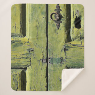 Closed brown wooden 2-panel door sherpa blanket