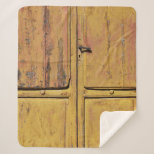 Closed brown wooden cabinet sherpa blanket