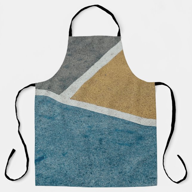 Closeup gray, yellow, and blue painted pavement apron (Front)