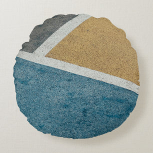 Closeup gray, yellow, and blue painted pavement round cushion