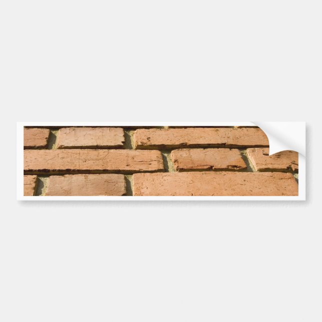 Closeup of a brick wall bumper sticker (Front)