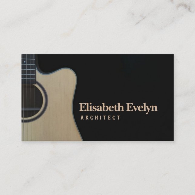 Closeup of cutaway acoustic guitar over black business card (Front)