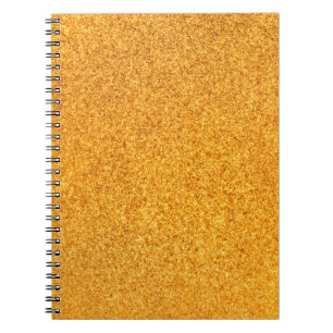 Closeup of golden matte metal texture. Shiny metal Notebook