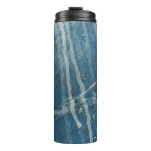 Closeup photo of blue wall paint thermal tumbler