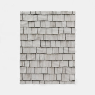 Closeup photo of grey roof shingles fleece blanket