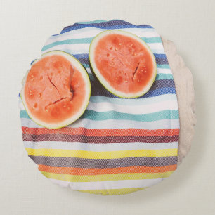 Closeup photo of slice watermelon fruits on cloth round cushion