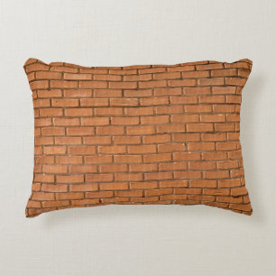 Closeup photography of brown brick wall decorative cushion