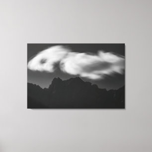 Clouds above mountain silhouette canvas print