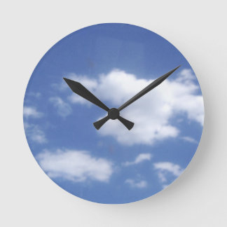 clouds in blue sky round clock