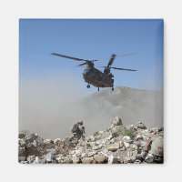 Clouds of dust kicked up by the rotor wash