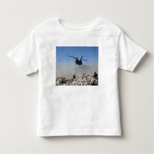 Clouds of dust kicked up by the rotor wash toddler T-Shirt