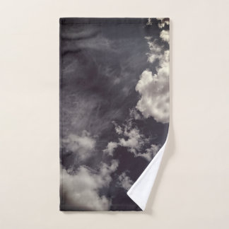 Clouds, on dark blue background hand towel