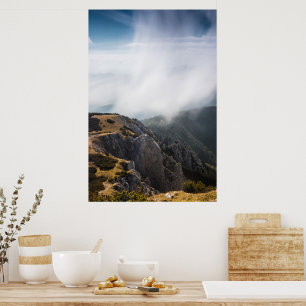 Clouds rolling over mountains poster