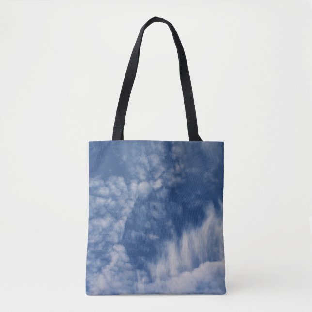 Clouds with teeth on an all over print tote bag (Front)