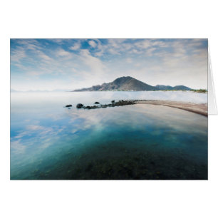Cloudy Blue Sky Reflecting In Lake