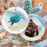 Coastal Beach Sea Turtle Mele Kalikimaka Photo Ceramic Tree Decoration<br><div class="desc">This Hawaiian tropical coastal themed holiday ornament is easily personalised with family name on the front and a photo on the back, and features a watercolor turquoise blue sea turtle on an abstract beach background with a faux gold glitter sparkly wave, and gold Mele Kalikimaka. Check out the collection for...</div>