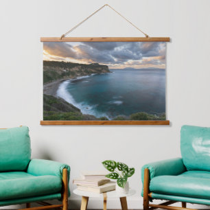 Coastal Calm: Sunset Over Cliffs Hanging Tapestry