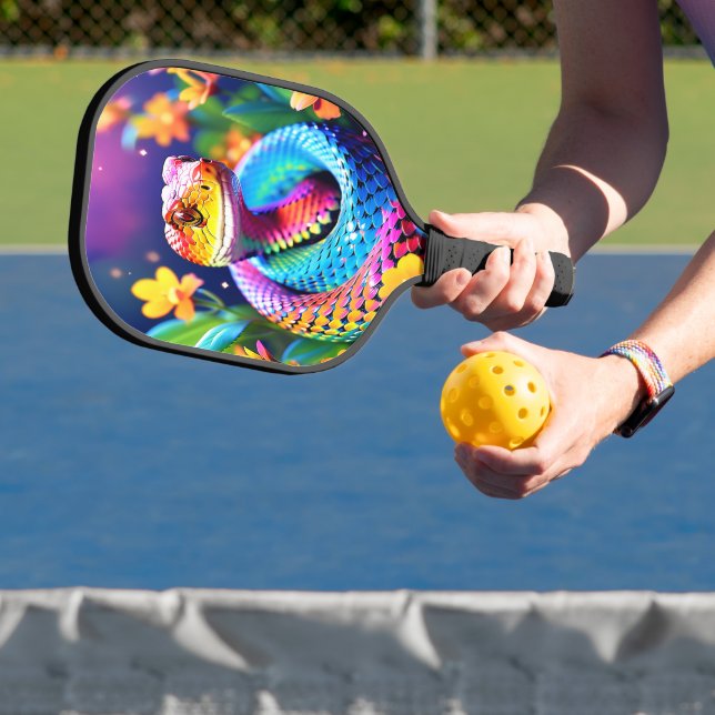 Cobra snake with vibrant turquoise pink and yellow pickleball paddle (Insitu)