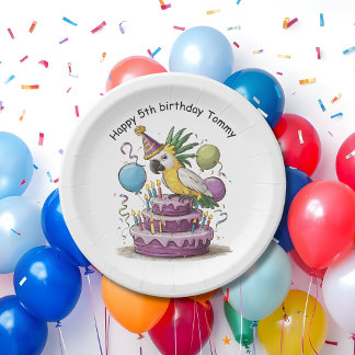 cockatoo perched on birthday cake balloons paper plate