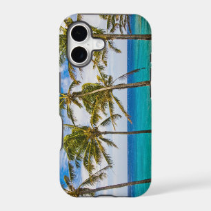 Coconut palm trees (Cocos nucifera) swaying in