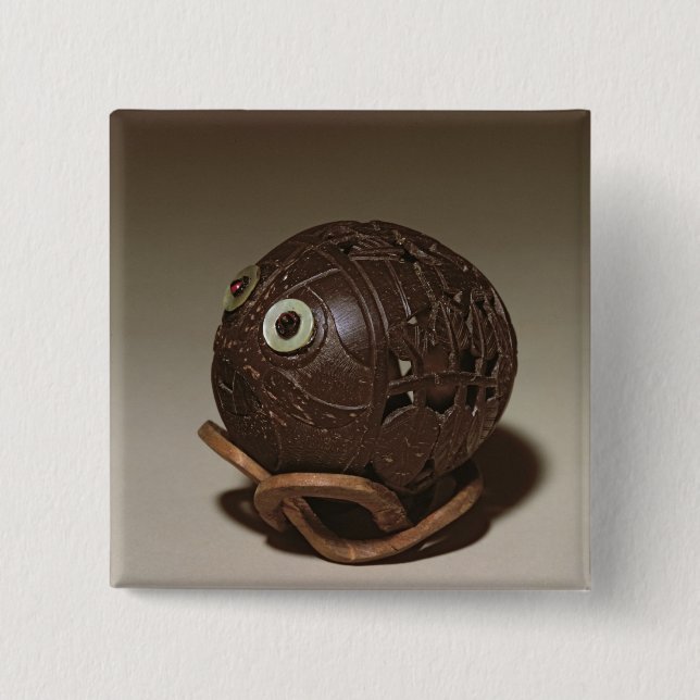 Coconut sculpted into a face, c.1895 15 cm square badge (Front)