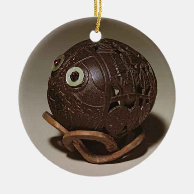 Coconut sculpted into a face, c.1895 ceramic tree decoration (Front)