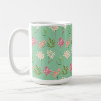coffee mug with floral design on green background
