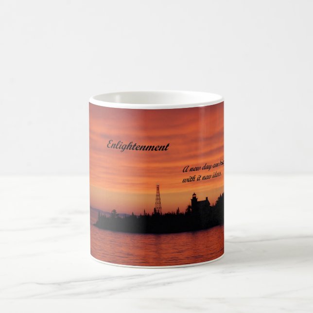 Coffee mug with picture of light house at sunrise. (Center)