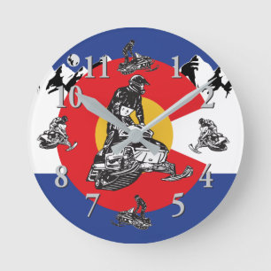 Colorado Flag and Rocky Mountains and snowmobiles Round Clock