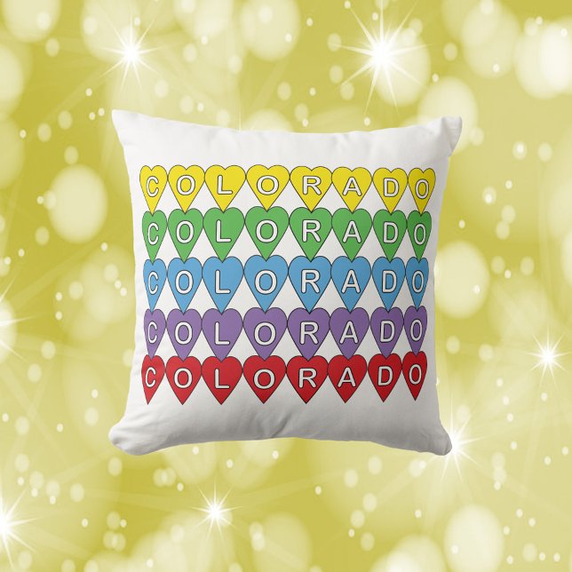 Colorado US State Hearts Colourful Rainbow Cushion (A throw pillow with the word Colorado in yellow, green, blue, purple and red hearts)