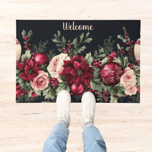 colorful christmas baubles with poinsettia doormat
