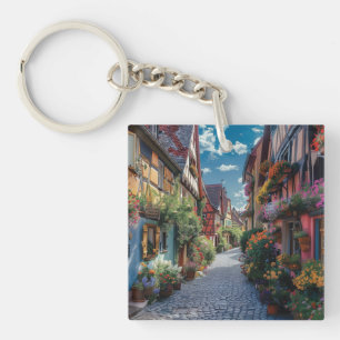 Colorful cobbled street decorated with flowers key ring