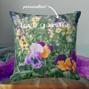 Colorful pansies in a summer country garden cushion